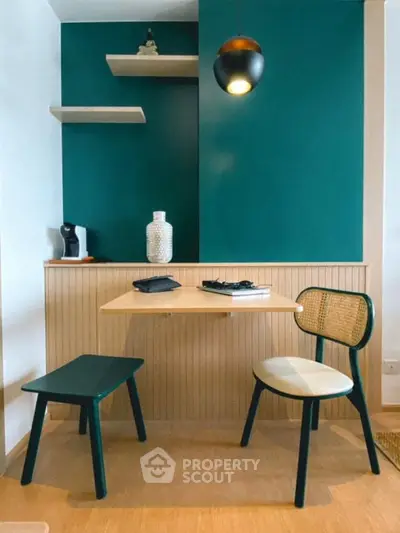 Chic study nook with modern furniture and stylish decor in vibrant teal and wood tones.