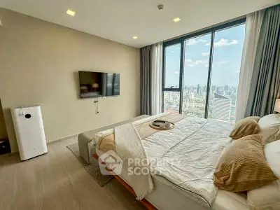 Luxurious bedroom with stunning city view and modern decor