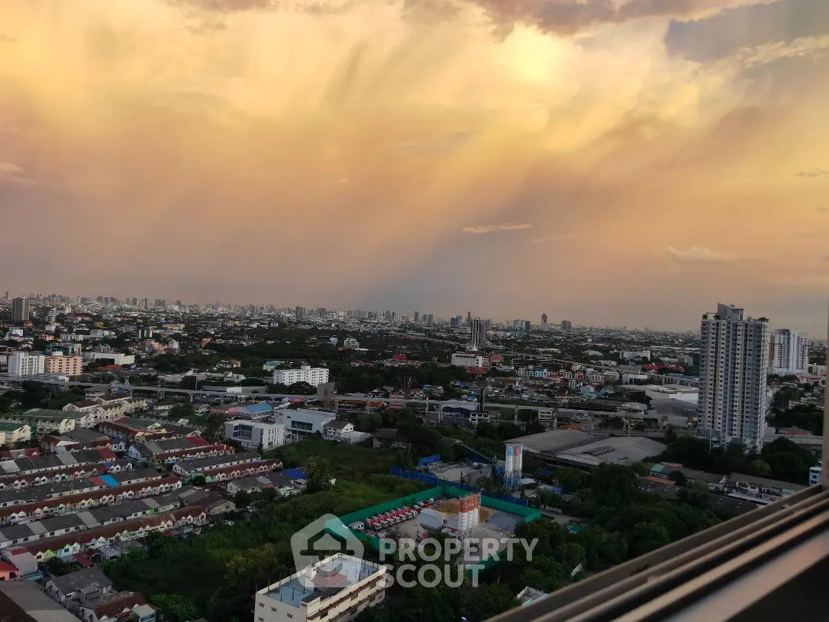 Stunning cityscape view at sunset with vibrant sky and urban skyline.