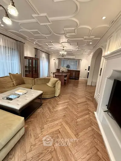 Luxurious living room with elegant ceiling design and spacious layout