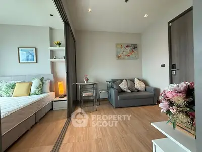 Modern studio apartment with cozy living area and stylish decor