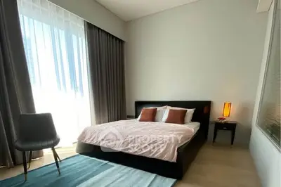 Modern bedroom with large window and stylish decor