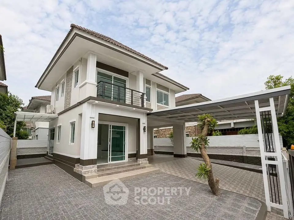 Modern two-story house with spacious driveway and sleek design