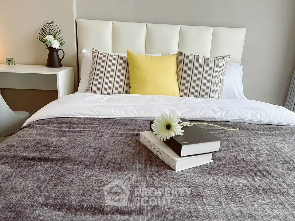 Elegant bedroom with plush bedding and stylish decor, perfect for a cozy retreat.