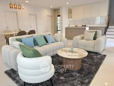 Modern living room with plush sofas and elegant decor in open layout