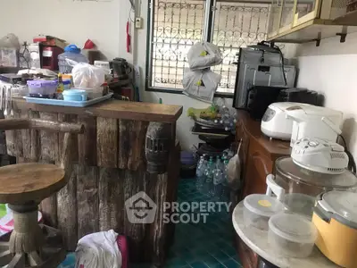 Cozy kitchen with rustic wooden counter and modern appliances