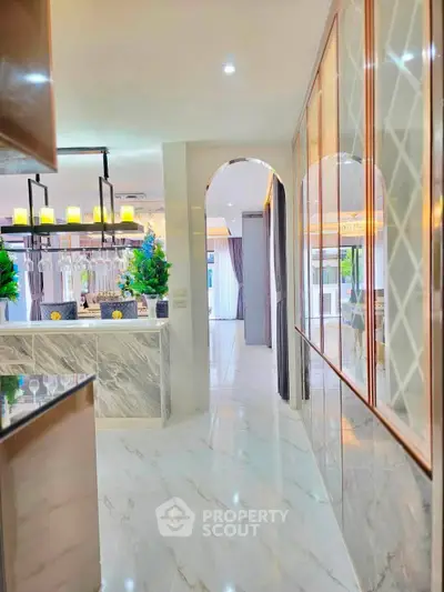 Luxurious modern kitchen with marble floors and elegant lighting