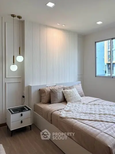 Modern bedroom with stylish decor and natural light