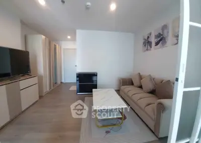Modern living room with stylish decor and comfortable seating in a contemporary apartment.