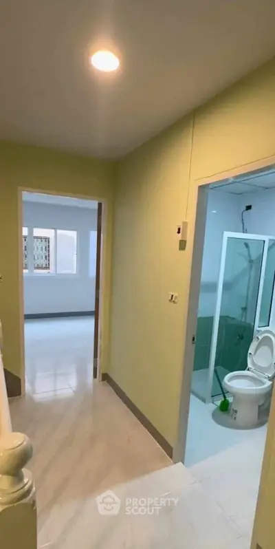 Modern hallway with bathroom view in contemporary home