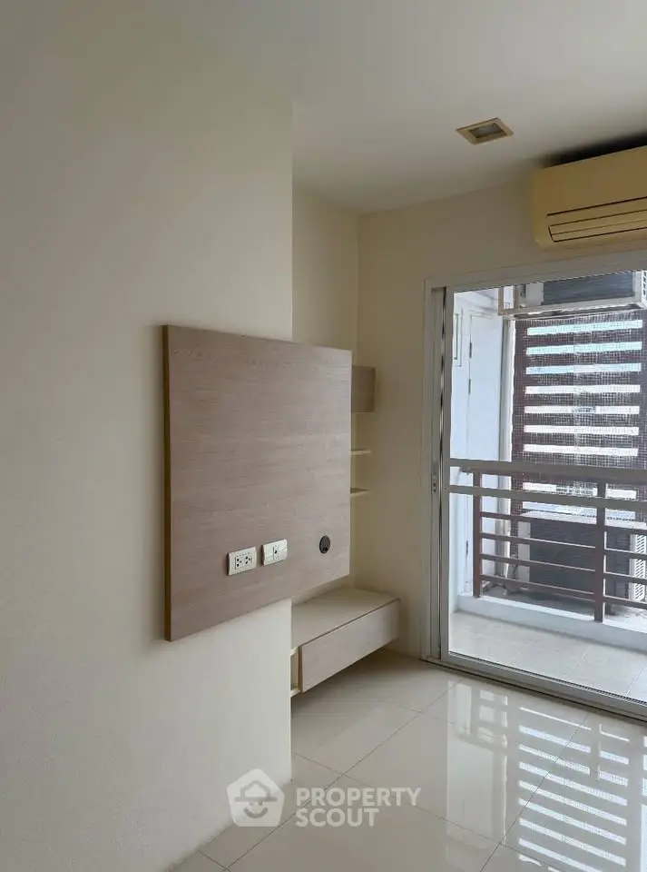 Modern apartment interior with balcony view and air conditioning