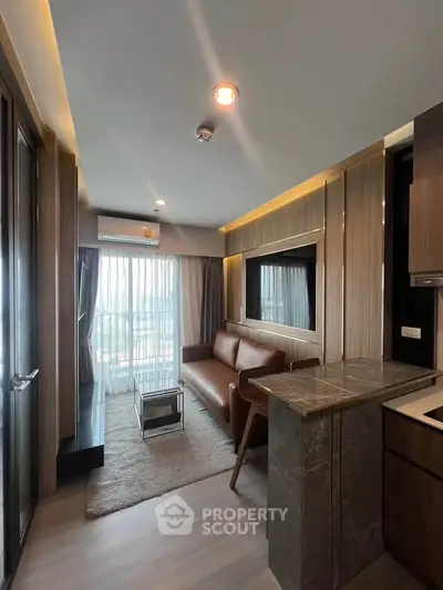 Modern living room with leather sofa and large window view