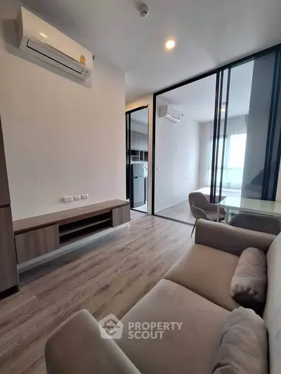 Modern living room with glass partition and air conditioning