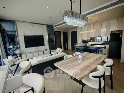 Luxurious modern living room with open kitchen and elegant chandelier