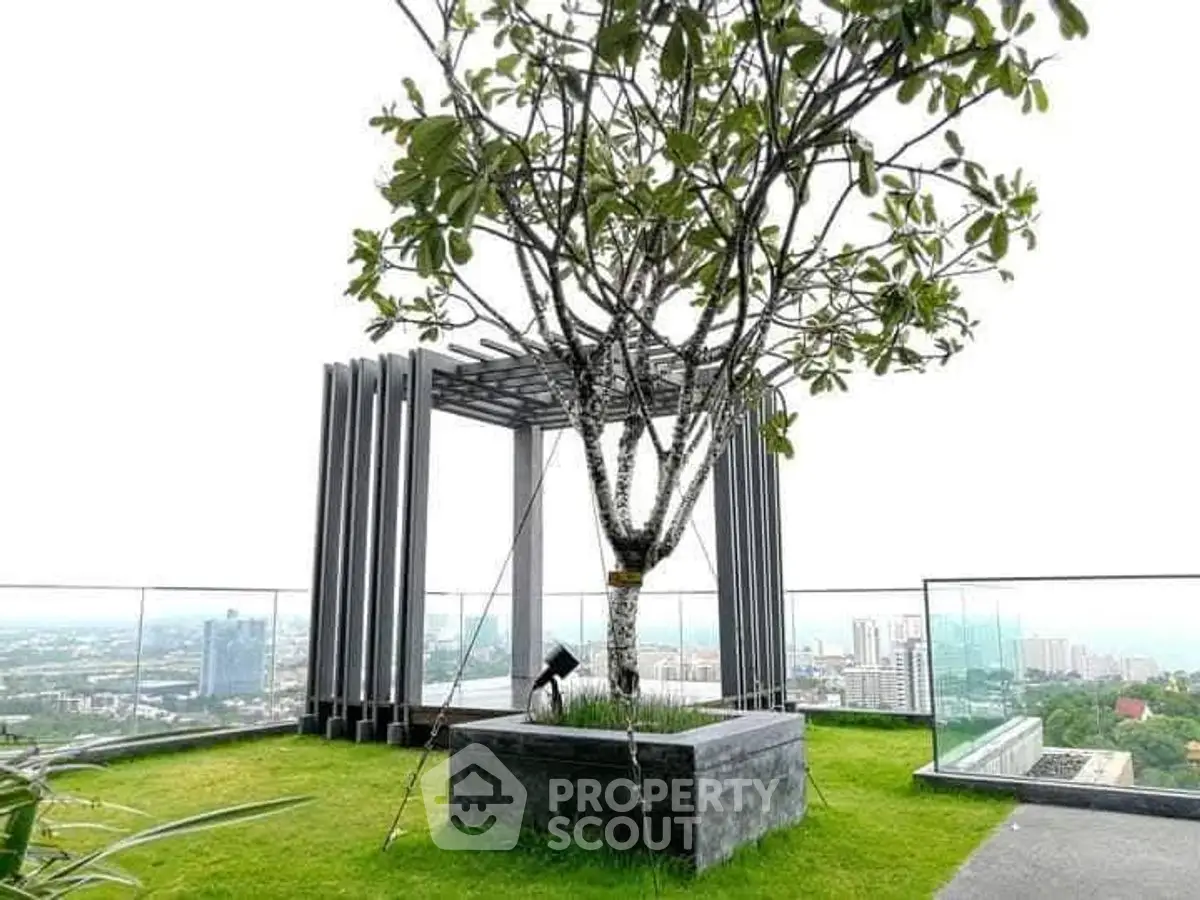 Stunning rooftop garden with panoramic city views and modern pergola.