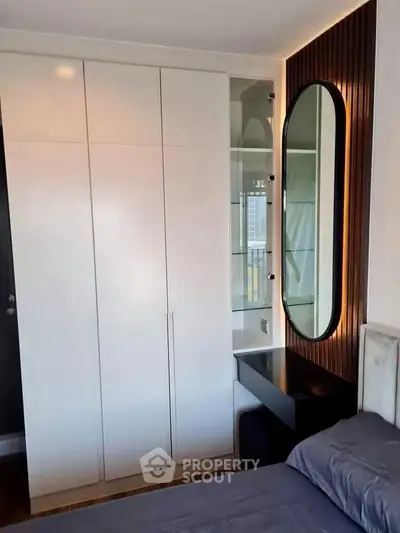 Modern bedroom with sleek wardrobe and stylish mirror design