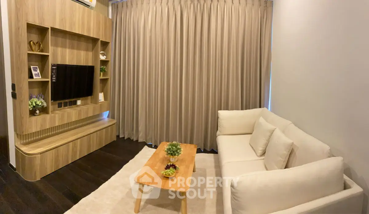 Modern living room with elegant wooden TV unit and cozy white sofa