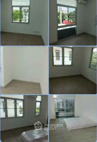 Spacious bedroom with large windows and natural light in modern apartment.