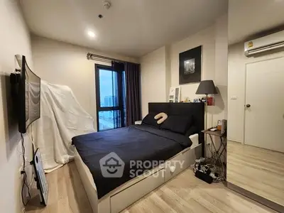 Modern bedroom with city view, sleek design, and cozy atmosphere.