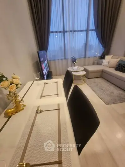 Modern living room with elegant decor and large window view