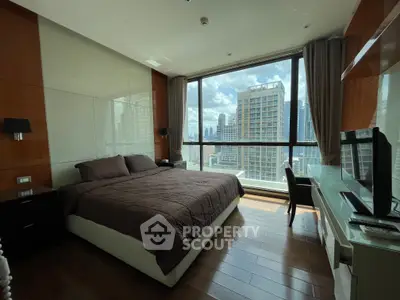 Luxurious bedroom with stunning city view and modern furnishings