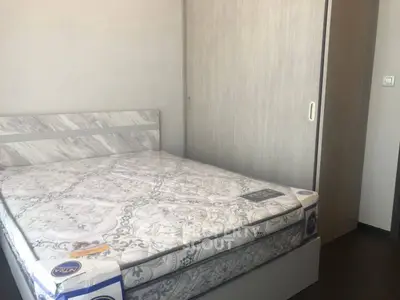 Modern bedroom with new mattress and sliding wardrobe in minimalist design.