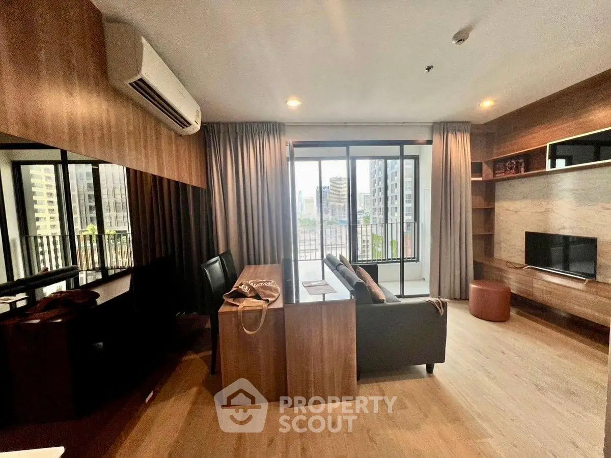 Modern living room with city view, stylish furniture, and natural light