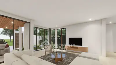 Modern living room with large windows and stylish furniture, offering a seamless indoor-outdoor experience.