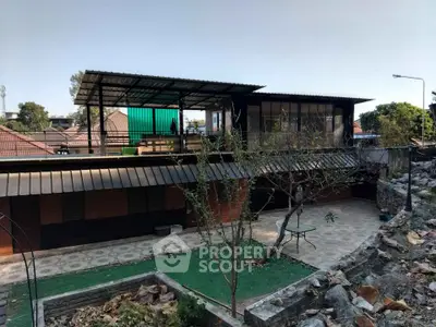 Modern multi-level home with rooftop terrace and spacious outdoor area.