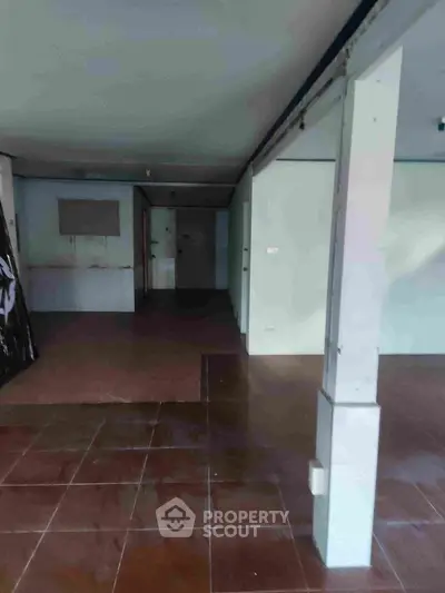 Spacious interior with tiled flooring and open layout, ideal for customization.