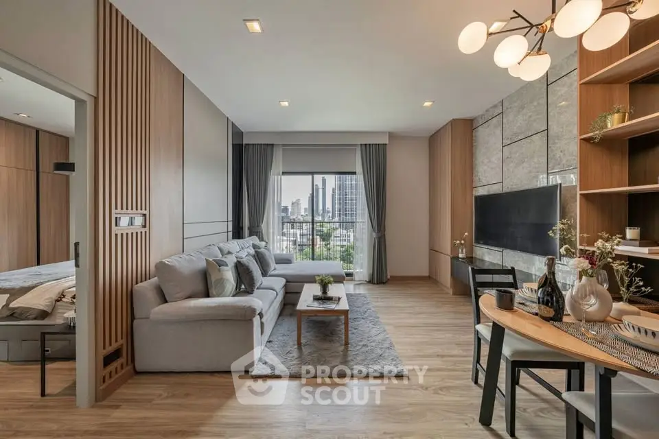 Modern living room with city view, stylish decor, and open layout