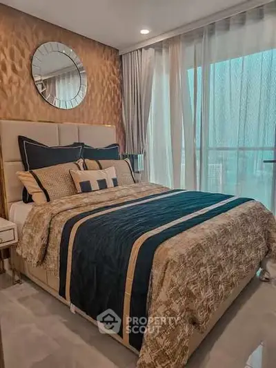 Luxurious bedroom with elegant decor and large window view.