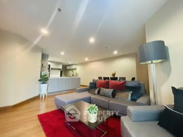 Spacious modern living room with open kitchen and stylish decor