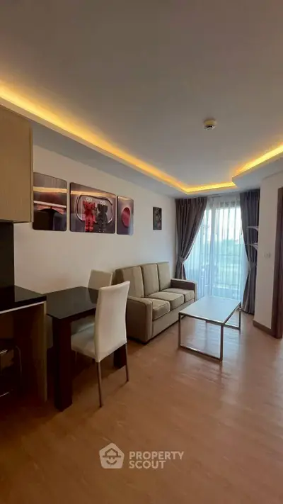 Modern living room with stylish decor and large window view