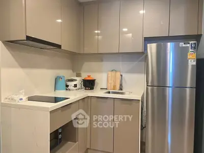 Modern kitchen with sleek cabinets and stainless steel appliances