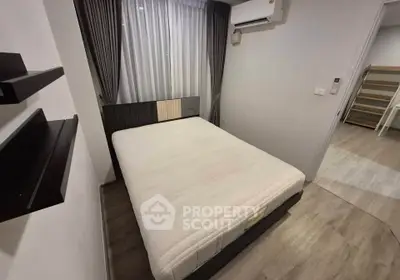 Cozy bedroom with modern design and air conditioning in a stylish apartment.