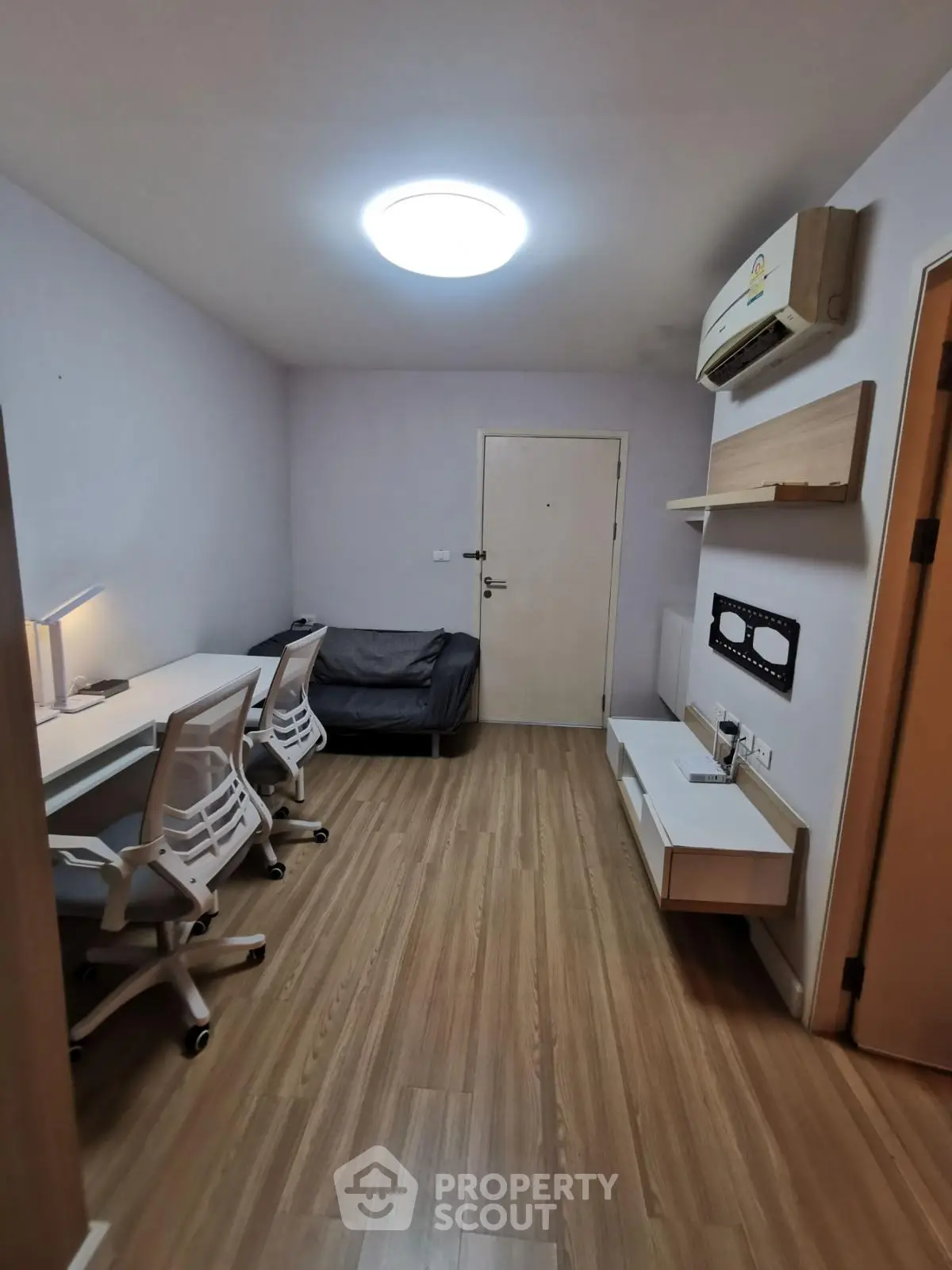 Modern study room with sleek furniture and wooden flooring