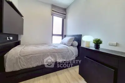 Cozy modern bedroom with natural light and sleek furnishings