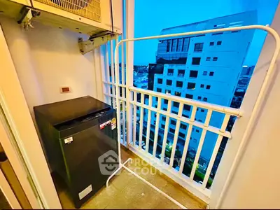 Compact balcony with washing machine and city view, ideal for urban living convenience.