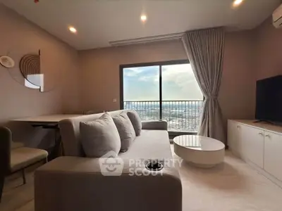 Modern living room with large window and city view, featuring cozy sofa and sleek furniture.