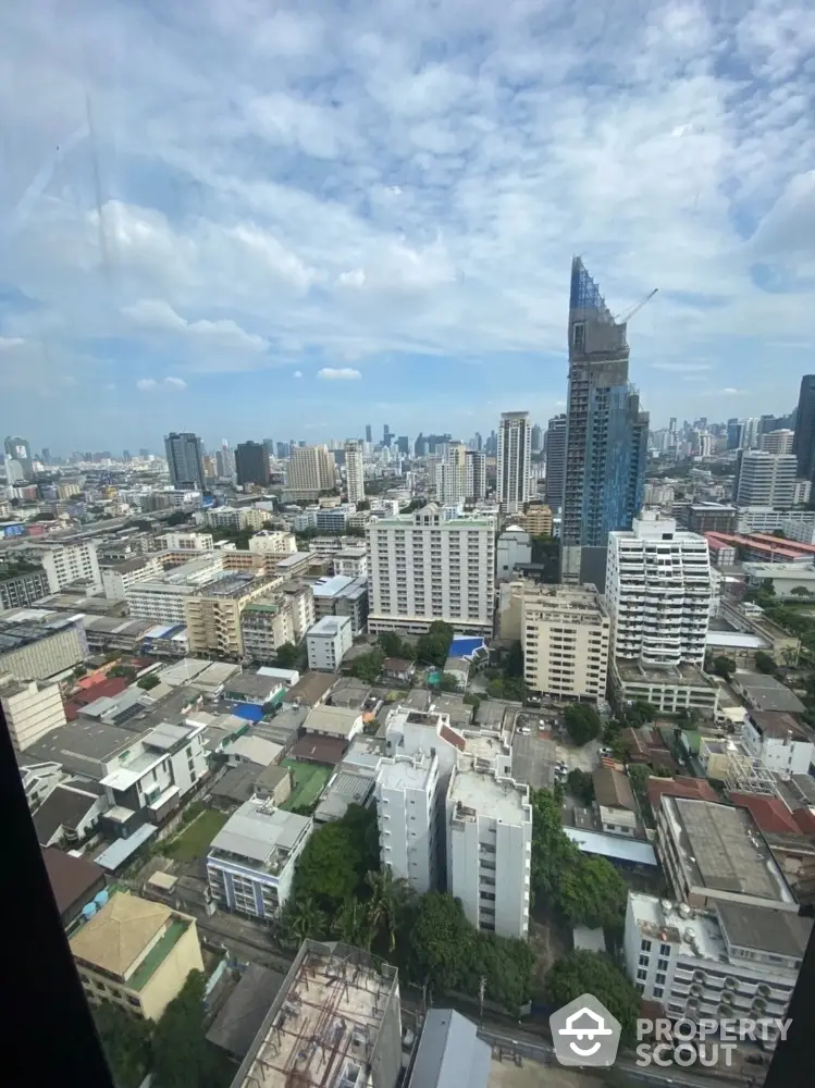 Stunning cityscape view from high-rise building showcasing urban skyline and architecture.