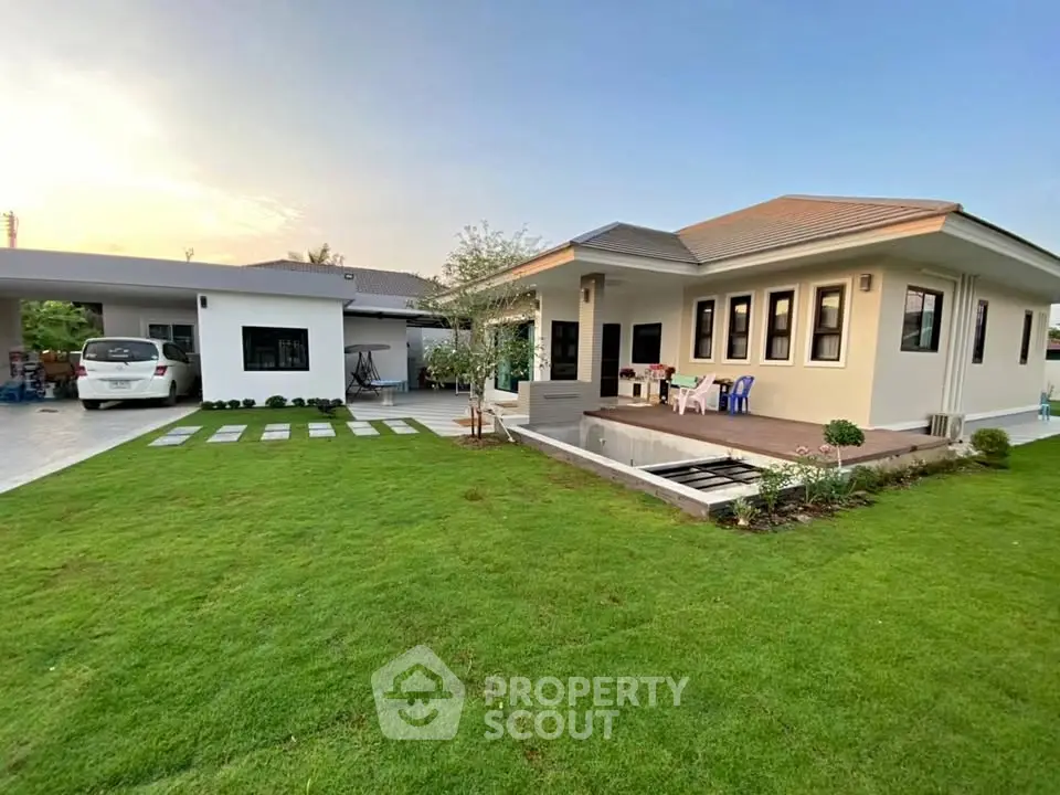 Charming modern home with spacious lawn and inviting patio area