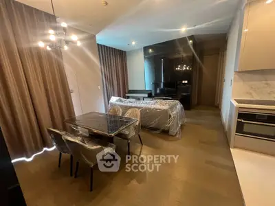 Modern living room with dining area and stylish lighting in a contemporary apartment.