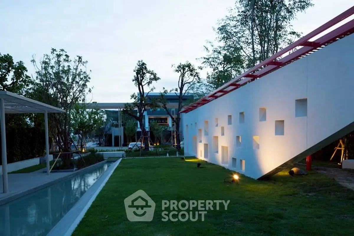 Modern architectural garden with unique wall design and lush greenery