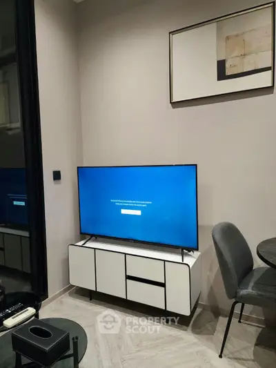 Modern living room with sleek TV setup and stylish decor