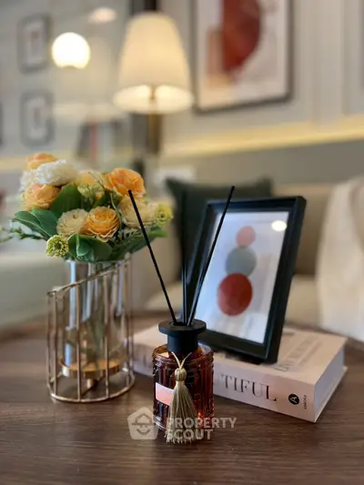 Elegant living room with stylish decor, featuring a chic coffee table and modern artwork.