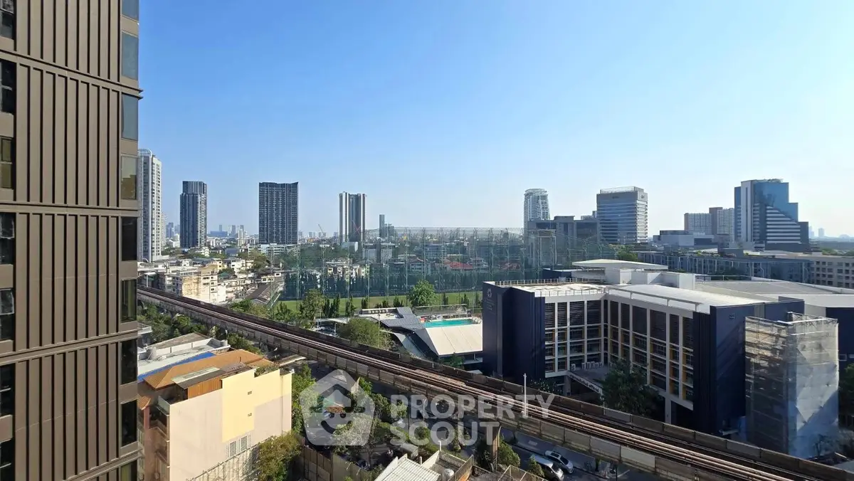 Stunning cityscape view from high-rise building showcasing urban skyline and modern architecture.