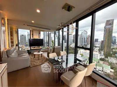 Luxurious corner unit living room with panoramic city views and modern furnishings.