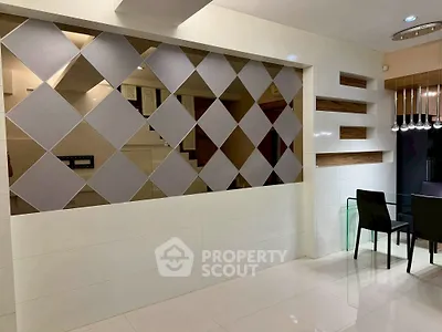 Modern interior with stylish partition wall and sleek dining area, perfect for contemporary living.