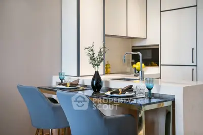 Modern kitchen with sleek design and elegant dining setup